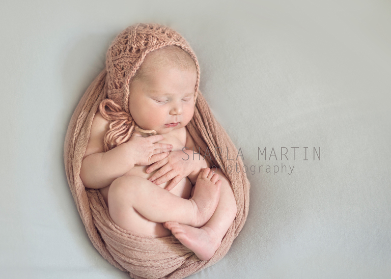 Newborn Baby in Pink Wrap
